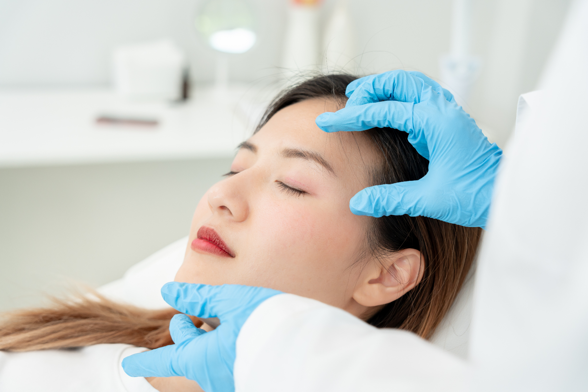 Woman receiving a Botox facial assessment at a Washington DC medical spa
